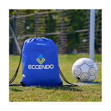 Load image into Gallery viewer, Blue drawstring bag with Eccendo logo next to a soccer ball on a grass field.