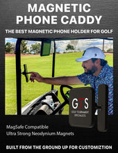 Load image into Gallery viewer, Man in a golf cart with a magnetic phone caddy attached, featuring GTS Golf Tournament Specialists branding.
