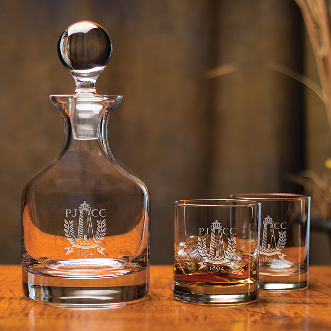 A decanter and two glasses with custom engraving