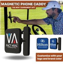 Load image into Gallery viewer, Magnetic phone caddy being used by a golfer with promotional text and logos.
